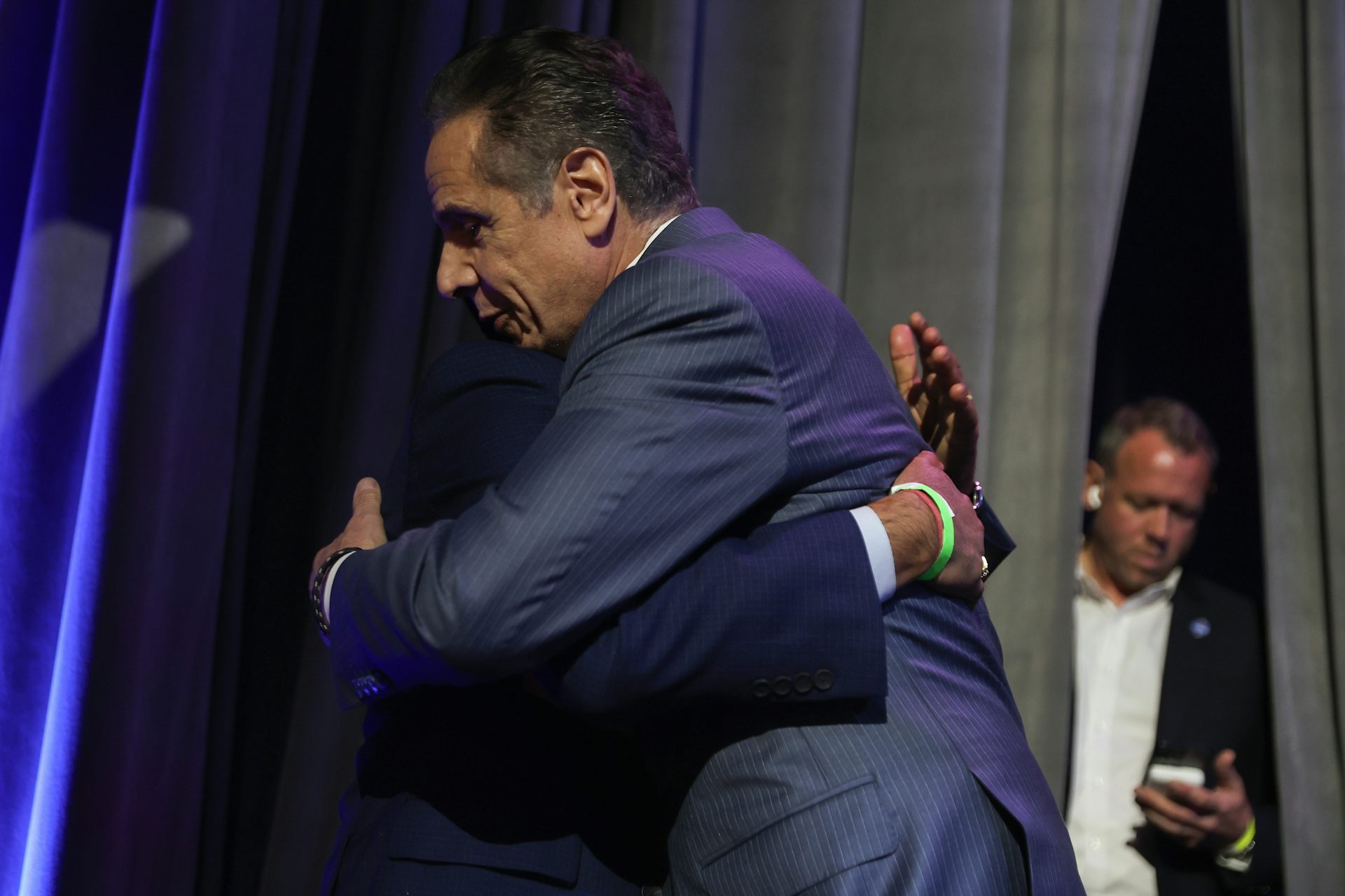 Former New York Governor Andrew Cuomo hugs a supporter on election night.