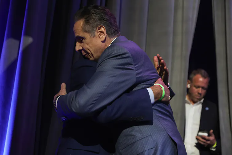 Former New York Governor Andrew Cuomo hugs a supporter on election night.