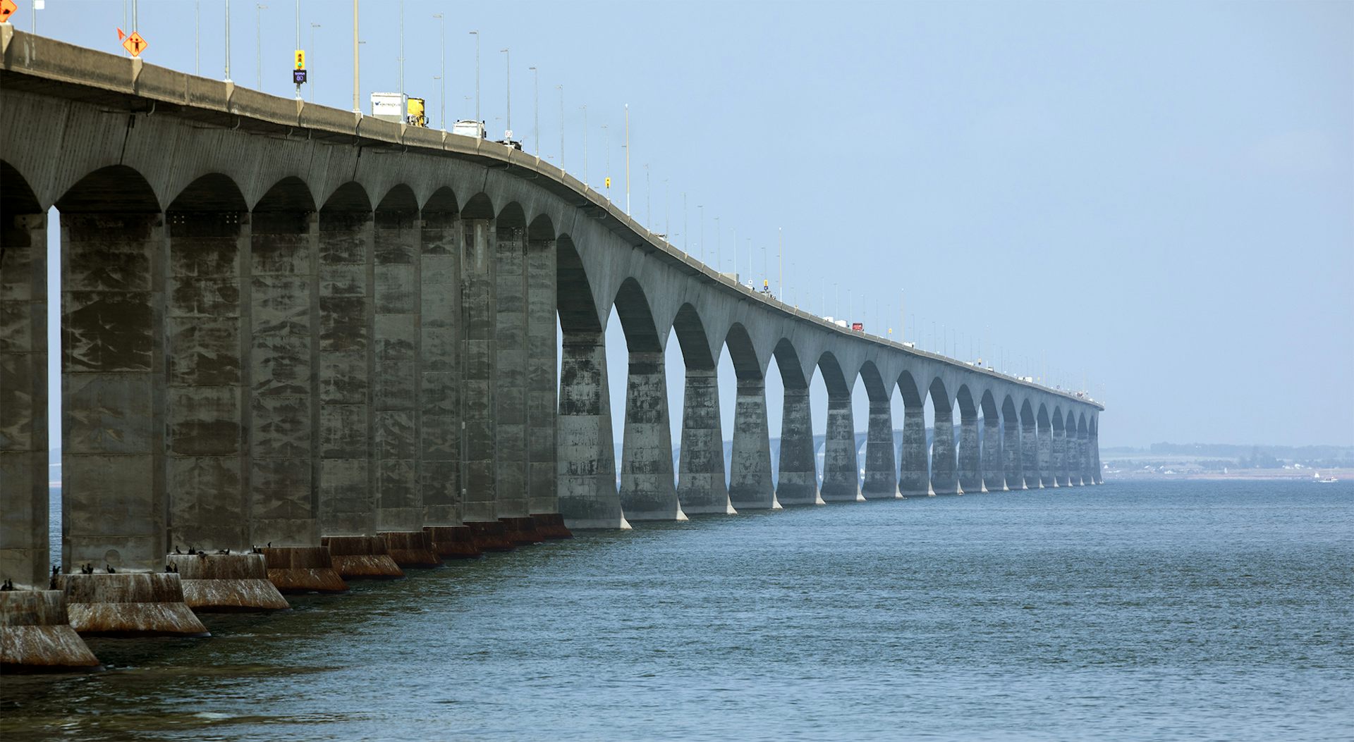 A long bridge stretches across a body of water