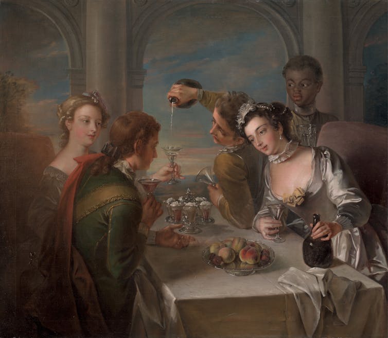 Two pairs of lovers sitting in an open loggia, attended by a black page, with wine bottles, six ices, and a discarded napkin at the head of the table, and silver dish of peaches and figs.
