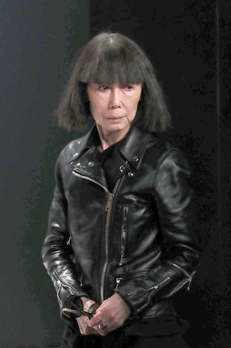 Kawakubo in a leather jacket.