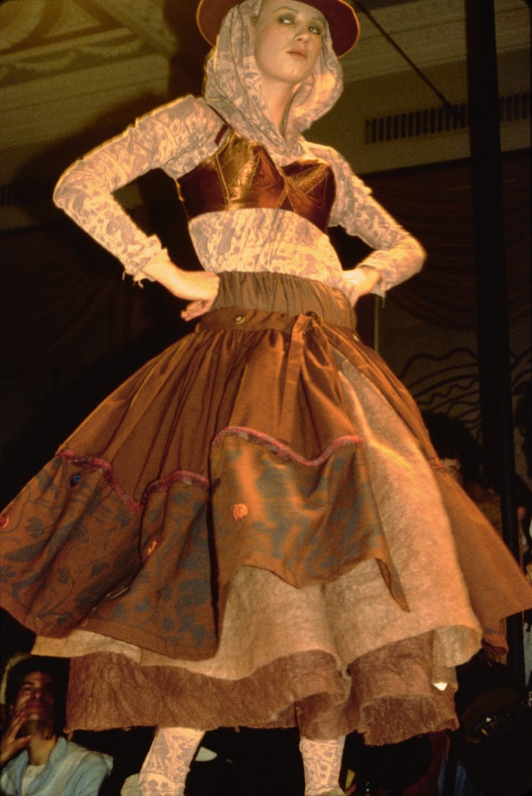 A model in a brown dress.