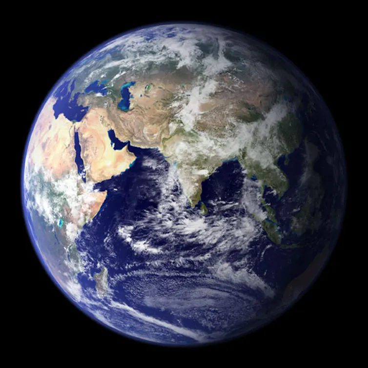 earth from space, showing ocean land and clouds.