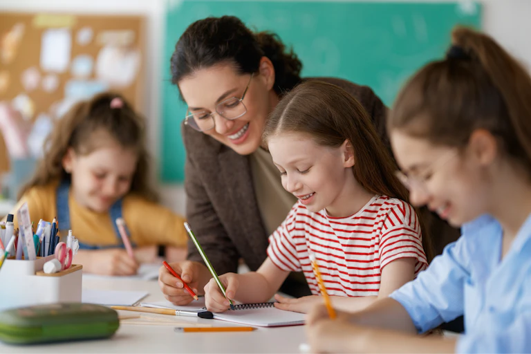 Teacher helping children