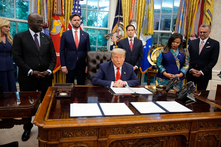 US president Donald Trump in the Oval Office at the signing of a peace deal with DRC foreign minister, Therese Kayikwamba Wagner, and Rwandan foreign minister, Olivier Nduhungirehe.