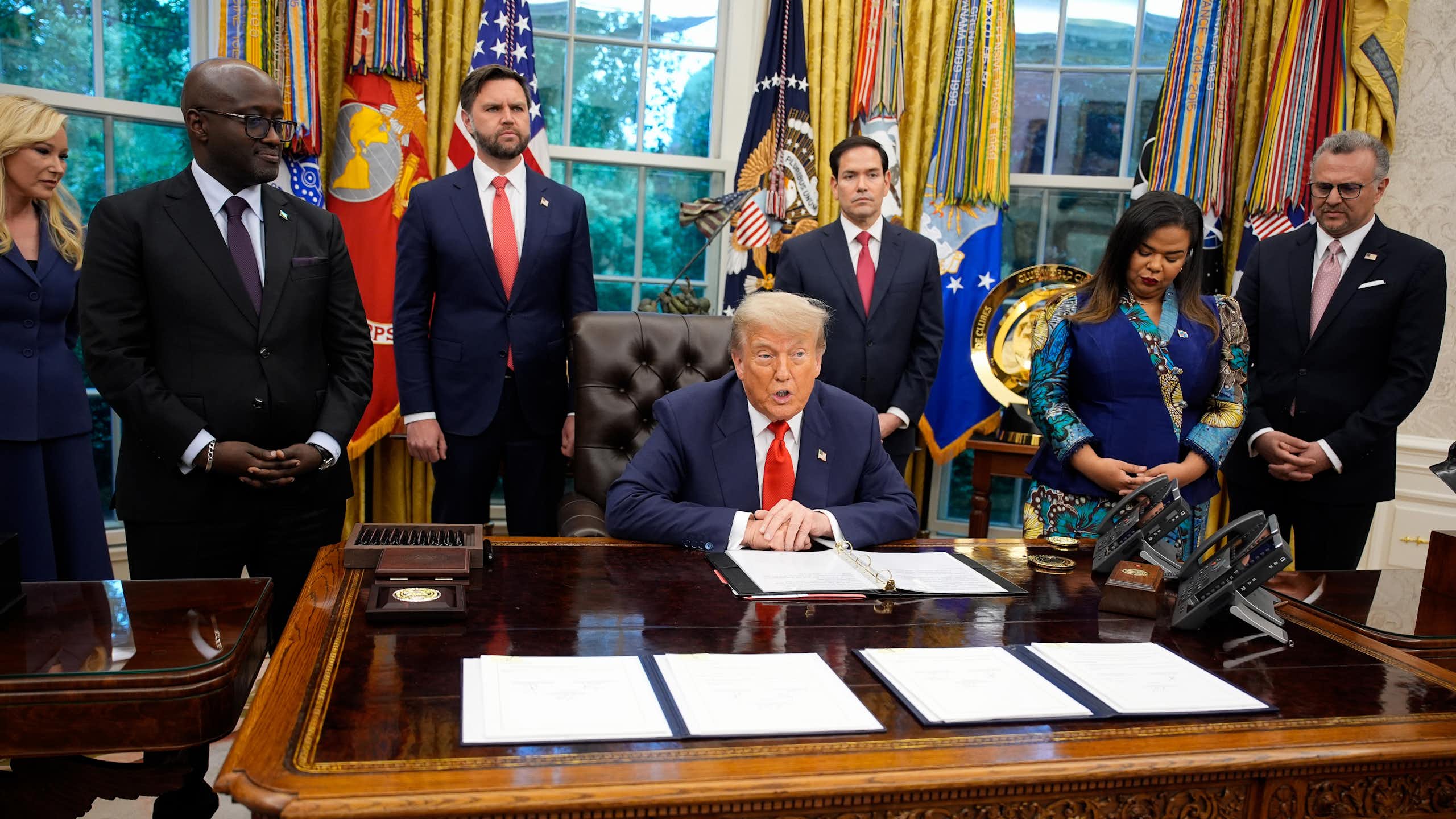 US president Donald Trump in the Oval Office at the signing of a peace deal with DRC foreign minister, Therese Kayikwamba Wagner, and Rwandan foreign minister, Olivier Nduhungirehe.