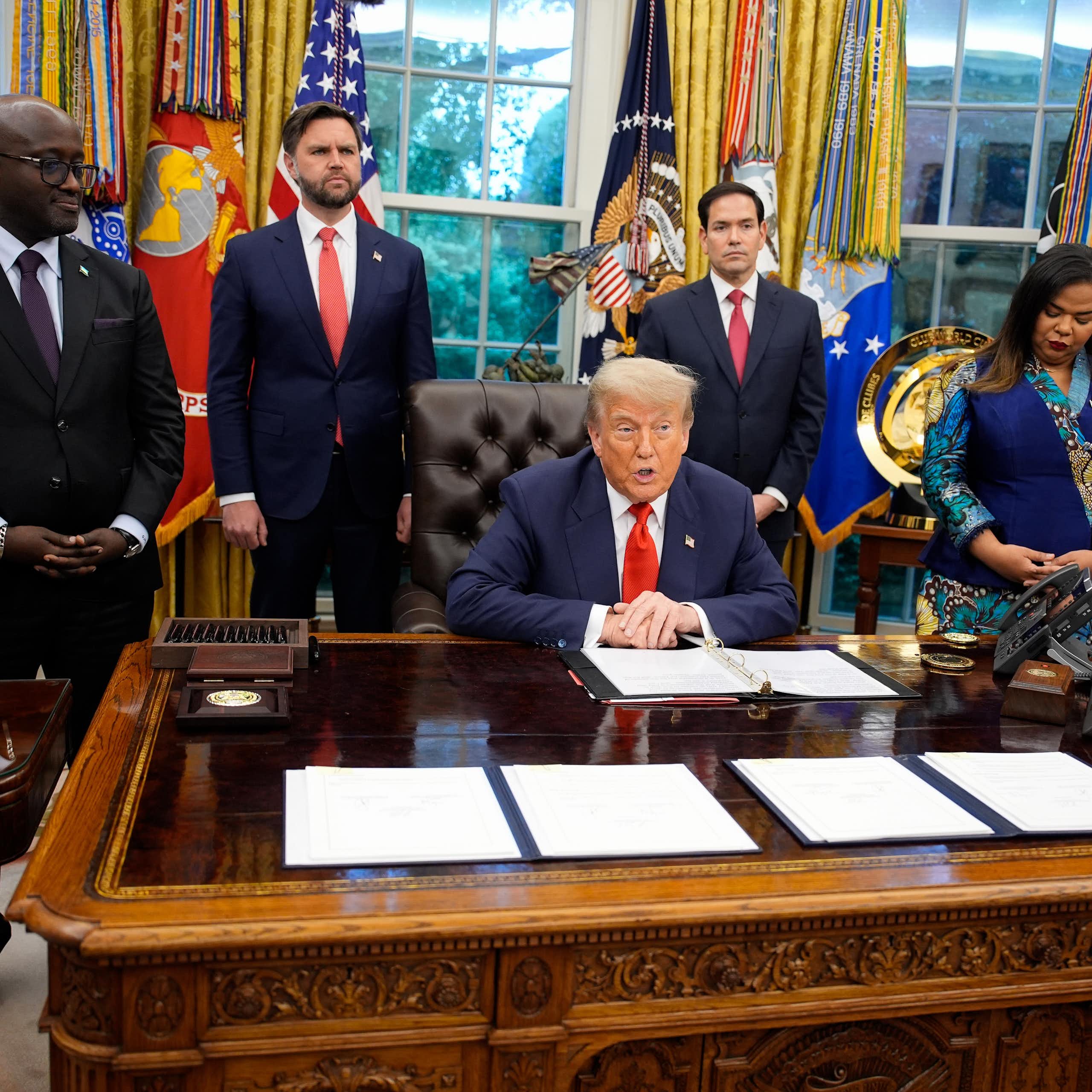 US president Donald Trump in the Oval Office at the signing of a peace deal with DRC foreign minister, Therese Kayikwamba Wagner, and Rwandan foreign minister, Olivier Nduhungirehe.
