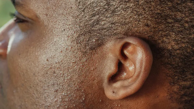 Close-up of a man's ear.