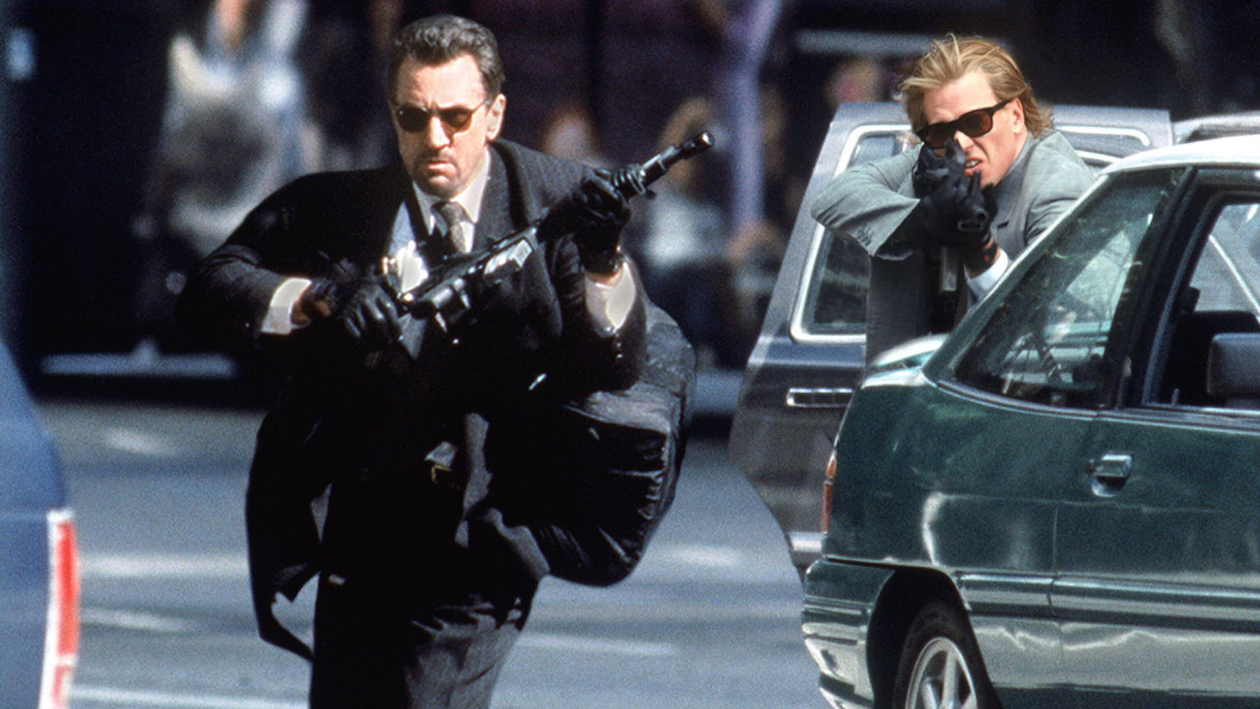 Robert De Niro and Val Kilmer wield guns in Heat.