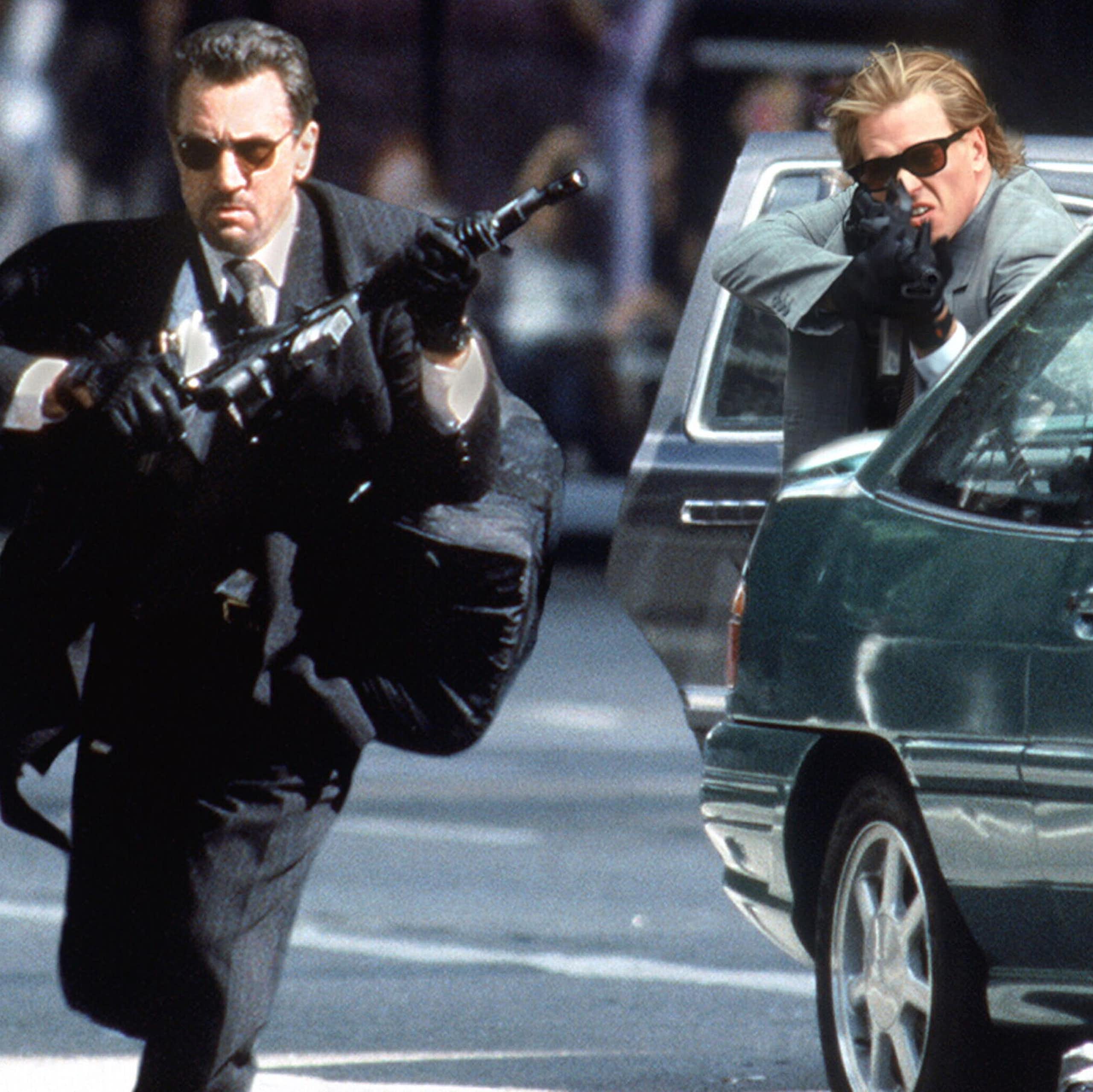 Robert De Niro and Val Kilmer wield guns in Heat.