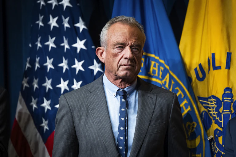 RFK Jr waits to speak to media in Washington in September