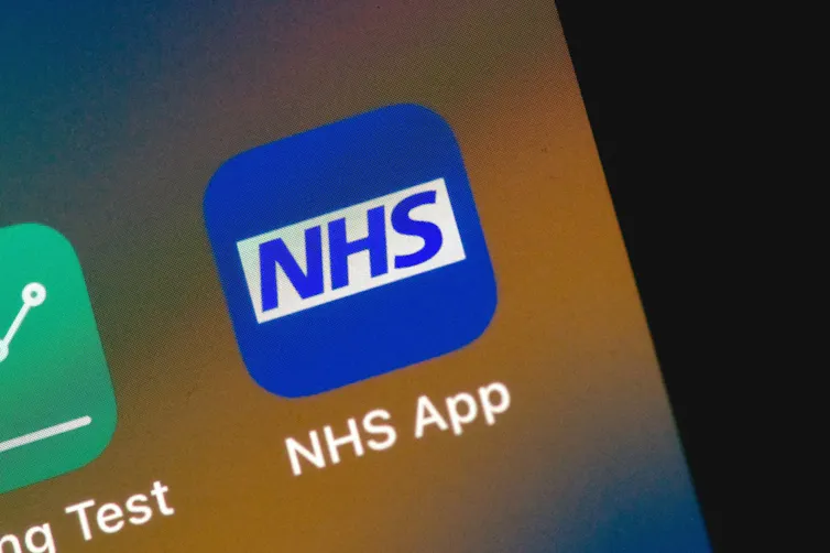 The NHS app on a phone screen.
