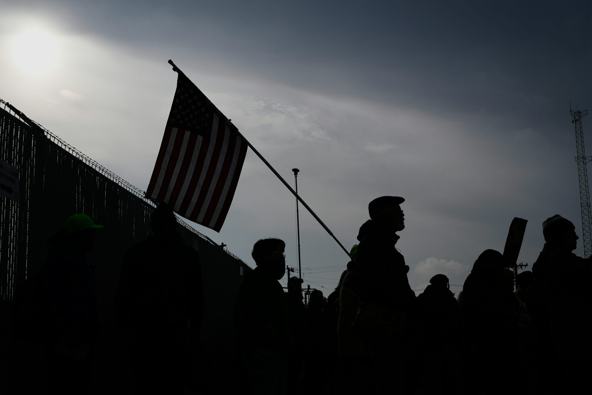 Protesters gather in front of a federal building.