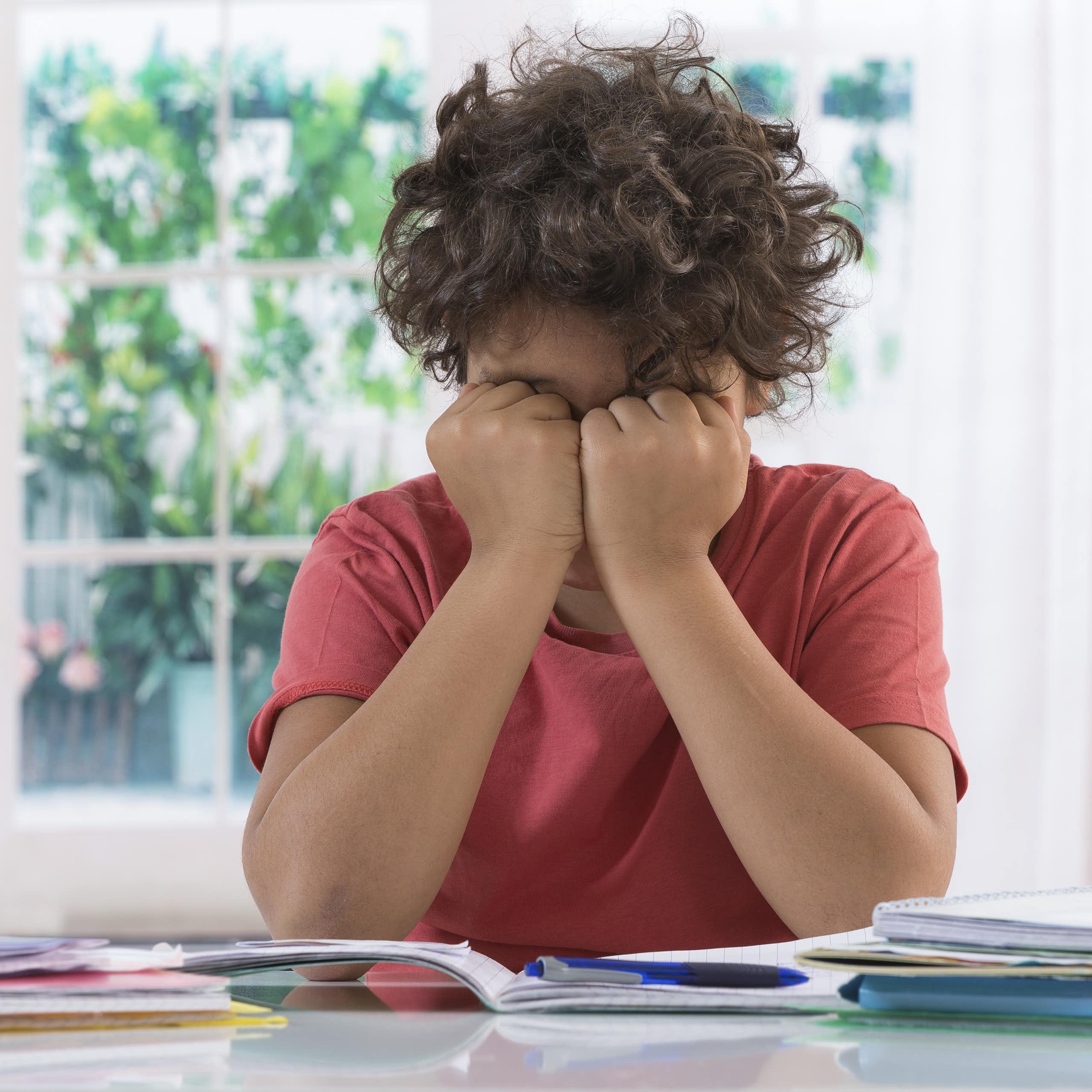 Boy struggling with homework