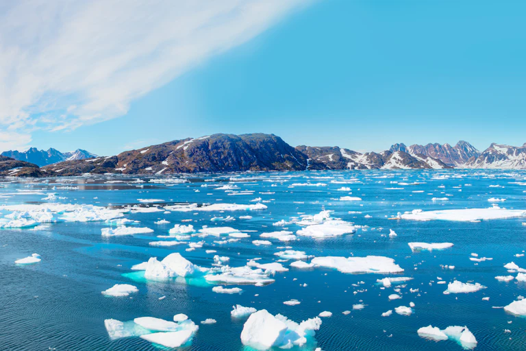 melting ice, greenland coast in background