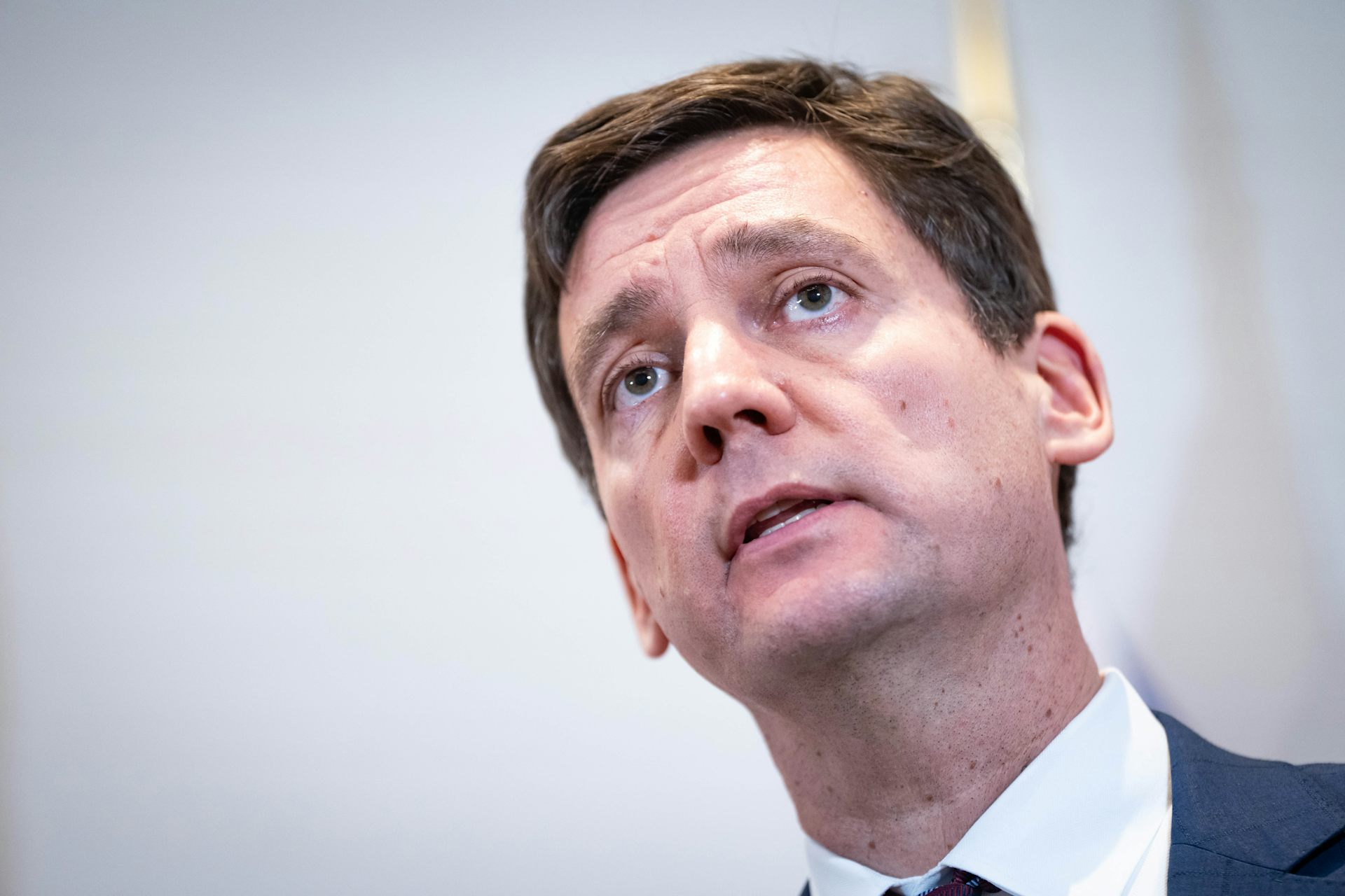 A man with short dark hair.