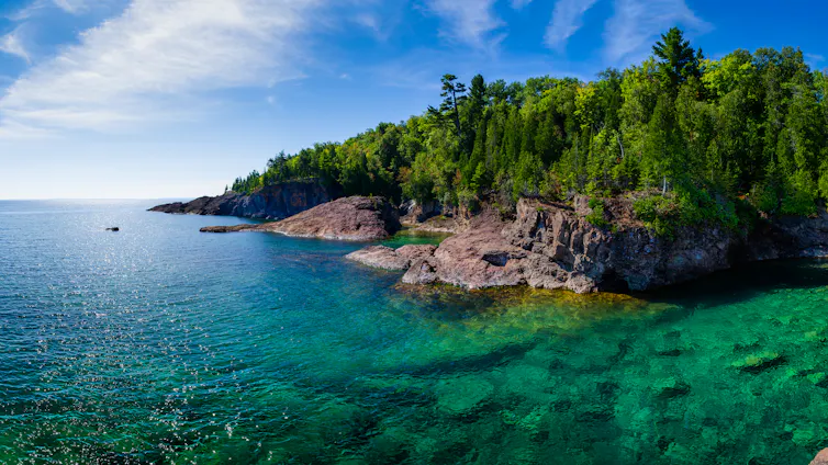 Clear blue water and lush greenery. PFAS