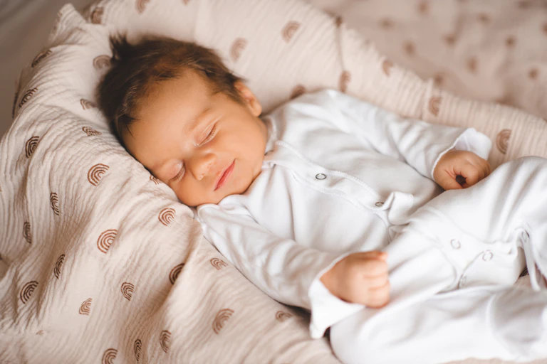 Baby smiles while sleeping