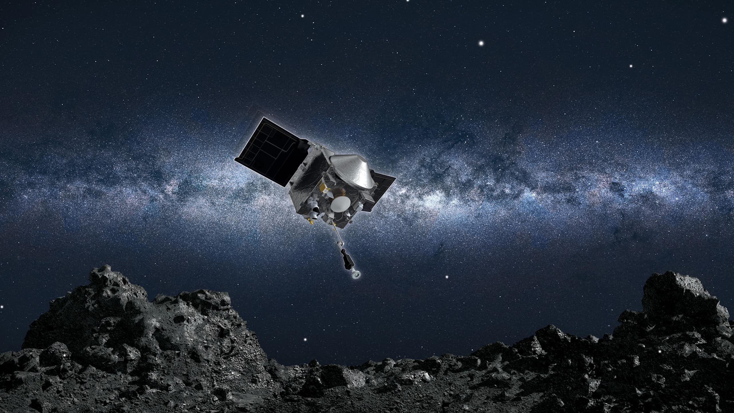 una sonda espacial acercándose a un terreno rocoso de un asteroide, Bennu