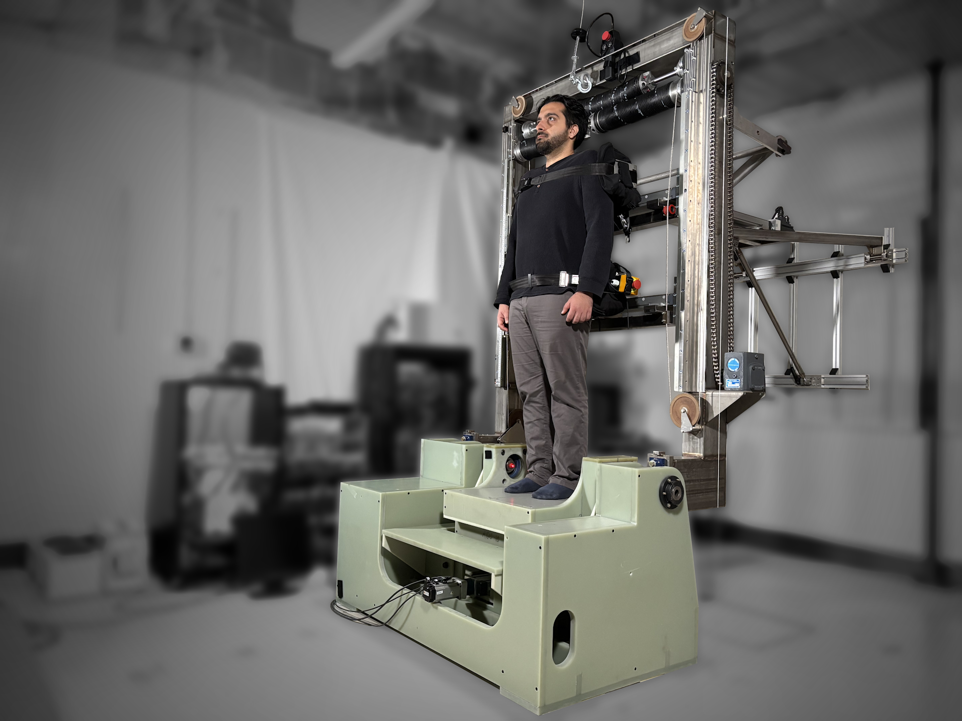 A man stands in a large piece of machinery.