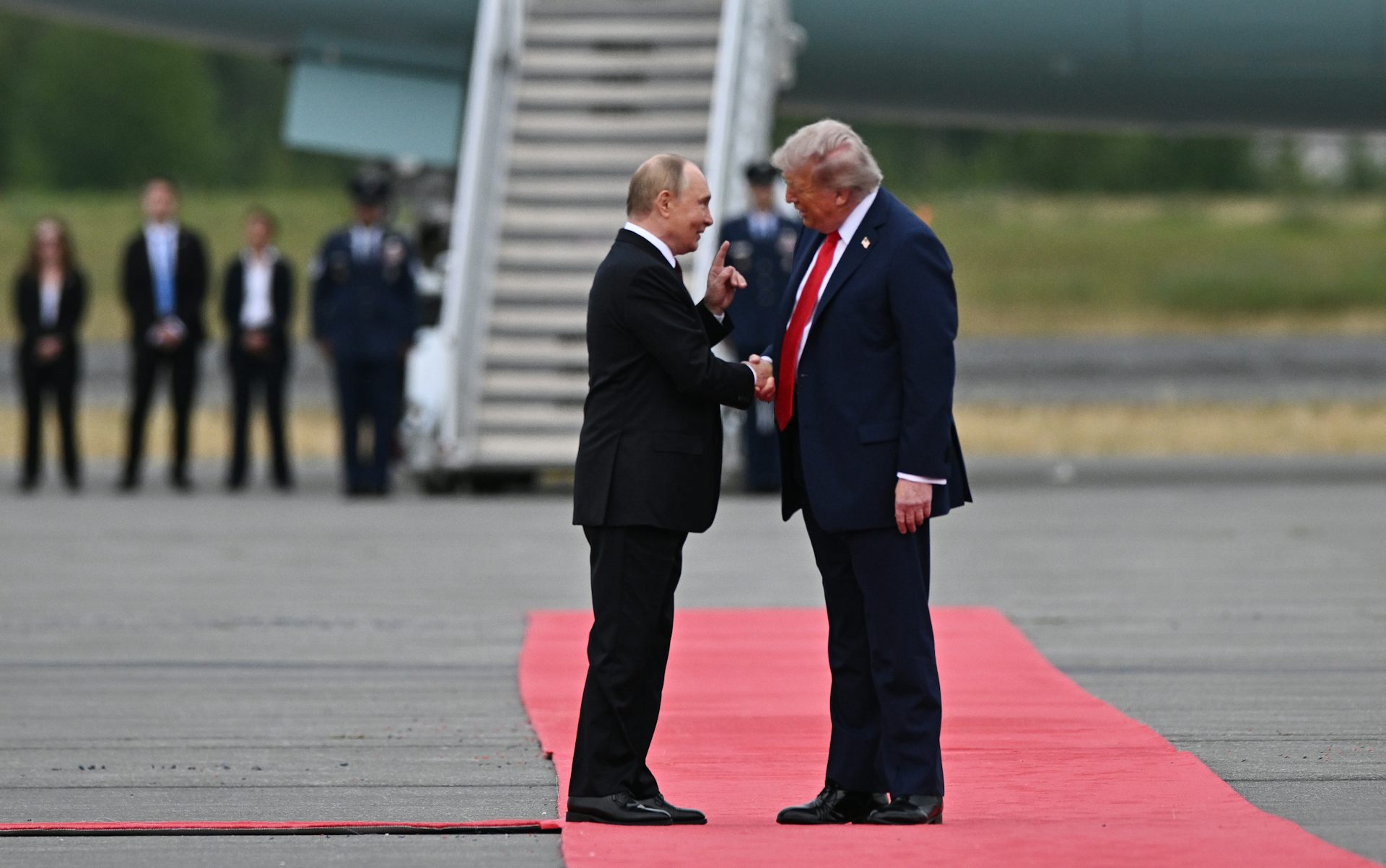 DOnald Trump greeting Vladimir Putin on the runway of Joint Base Elmendorf-Richardson in Anchorage, Alaska, USA, 15 August 2025.