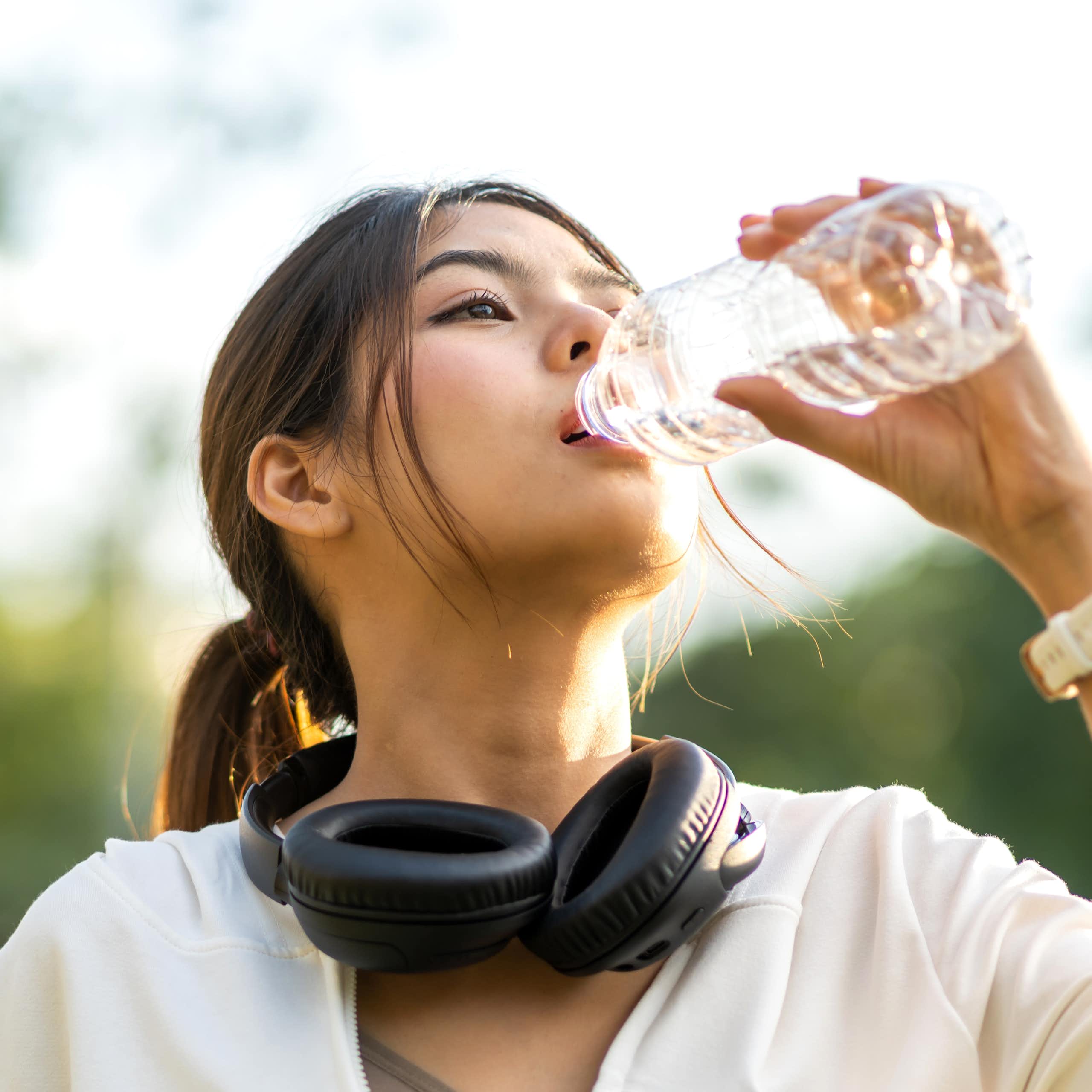 Woman drinking bottled water