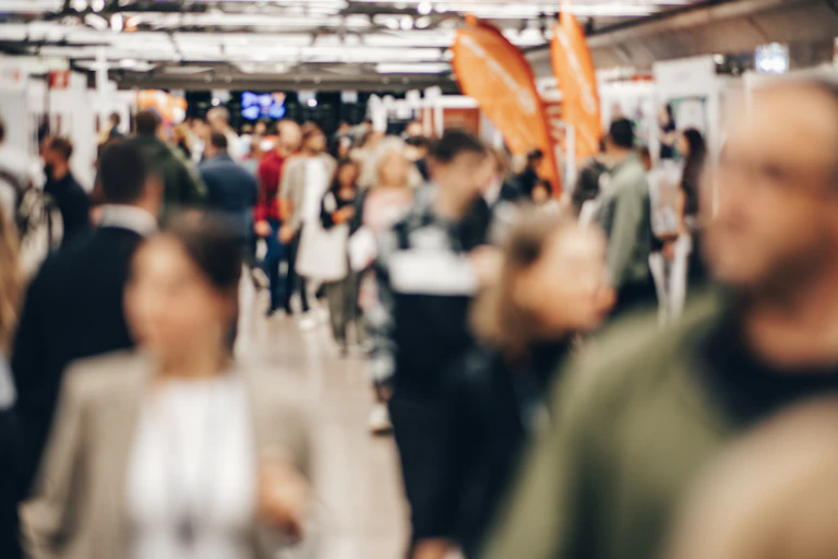 Blurred photo of people at career fair