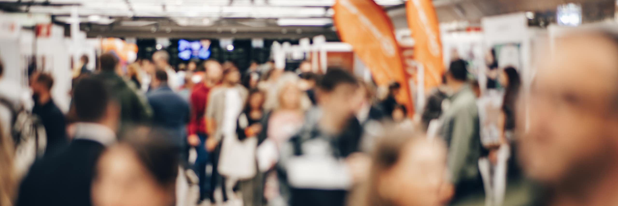 Blurred photo of people at career fair