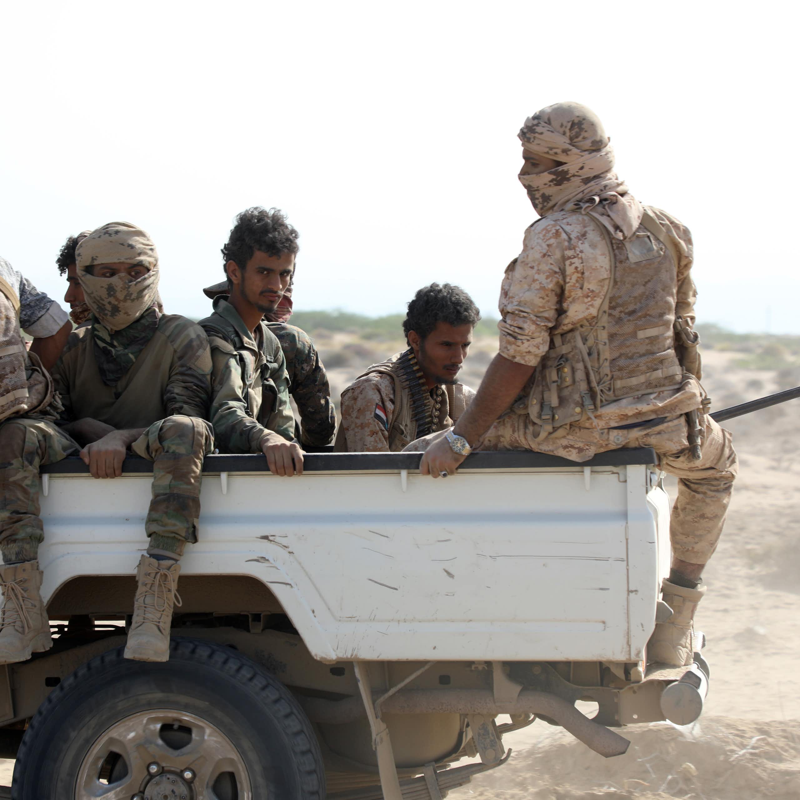 Fighters of the the Southern Transitional Council ride a truck.