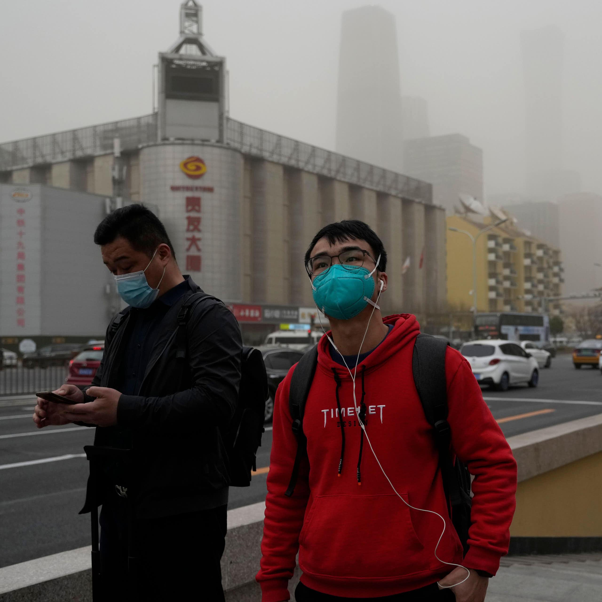 People in China wearing masks because of a major dust storm.
