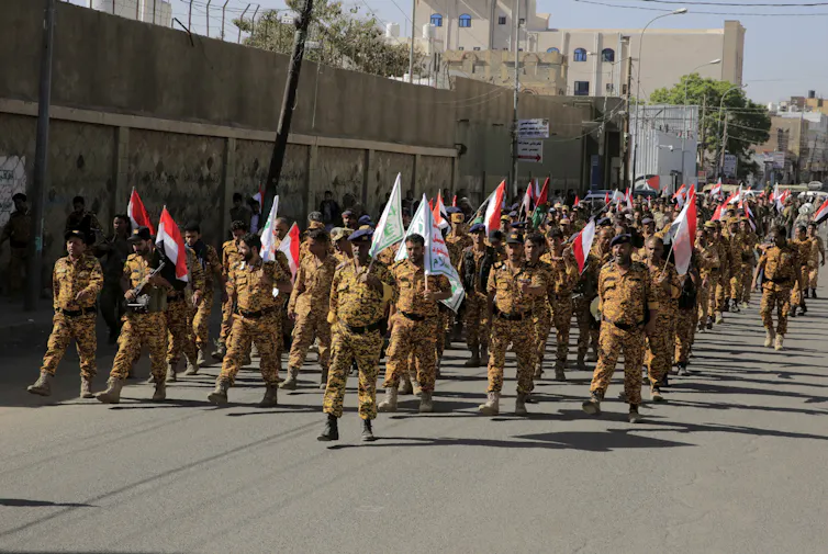 Houthi soldiers march during a parade in Sana'a.