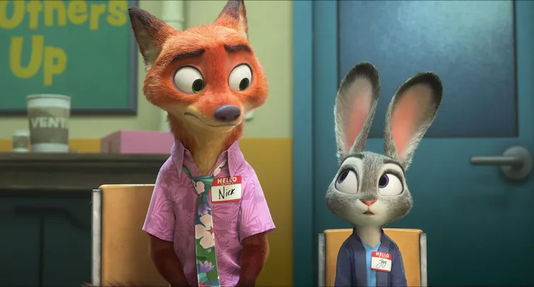 An animated scene shows a red fox and smaller grey rabbit sitting on chairs next to each other, looking at each other warily.