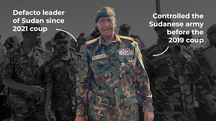 A man in army fatigues stands.