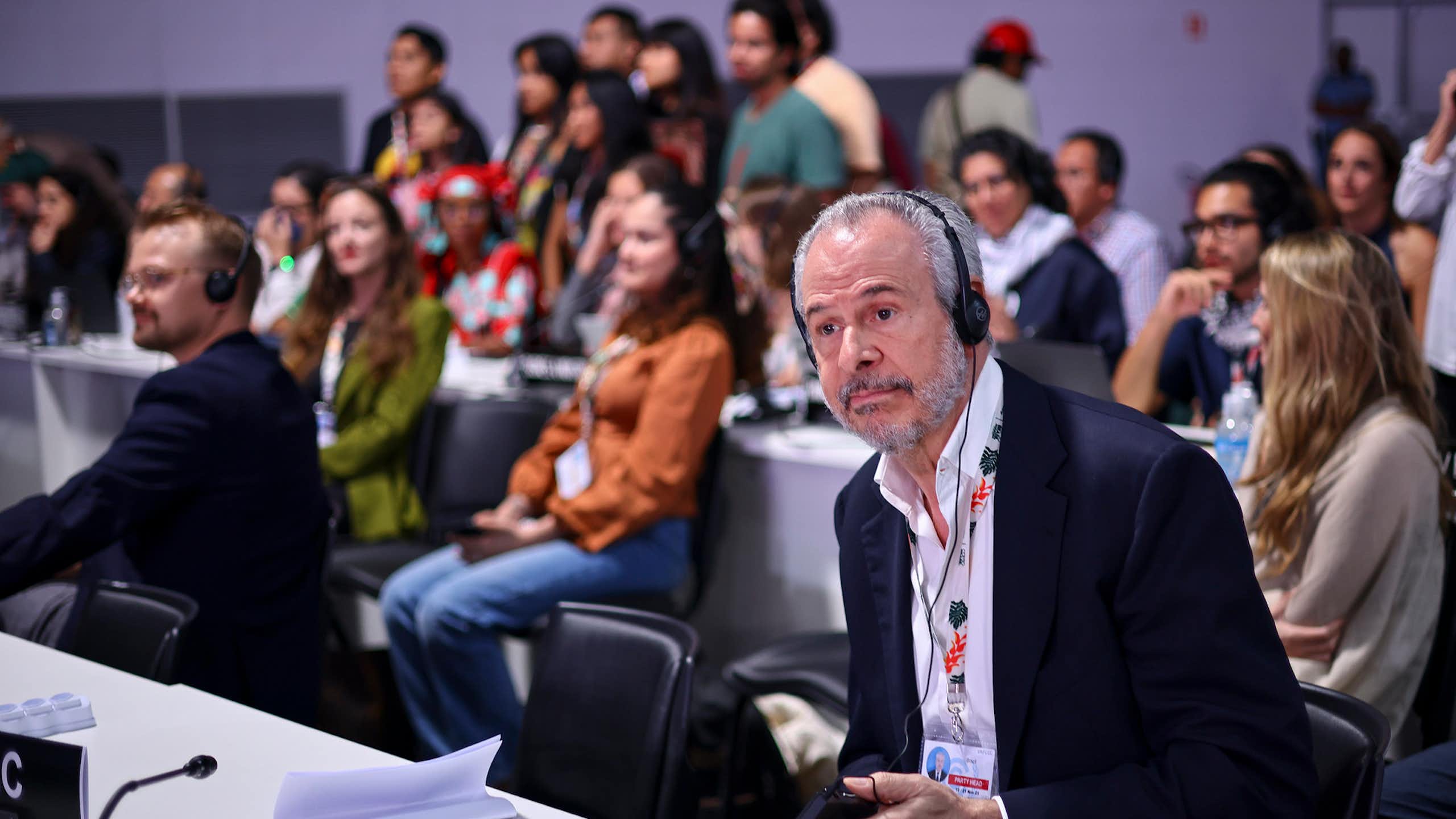world leaders talking with headphones on at UN conference