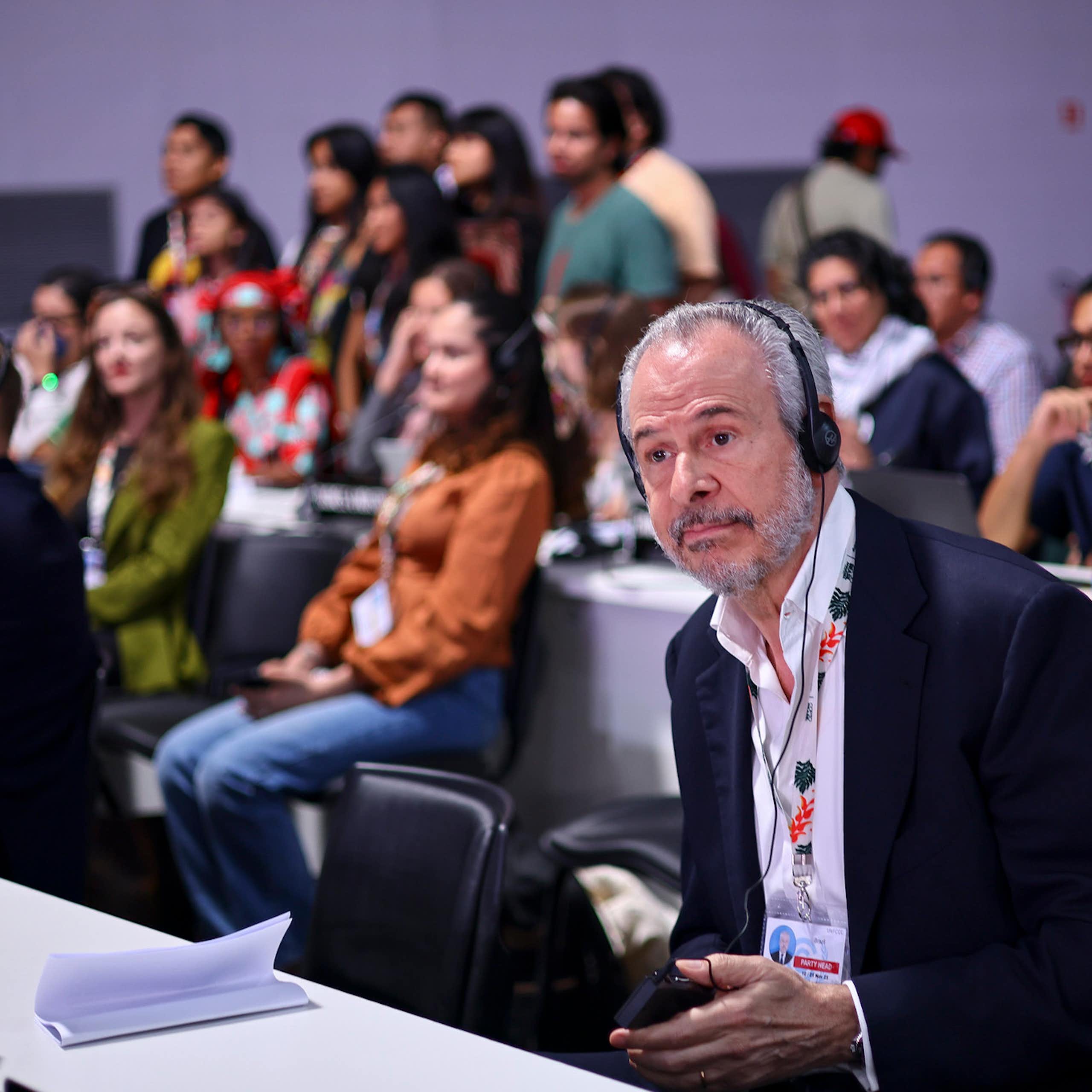 world leaders talking with headphones on at UN conference