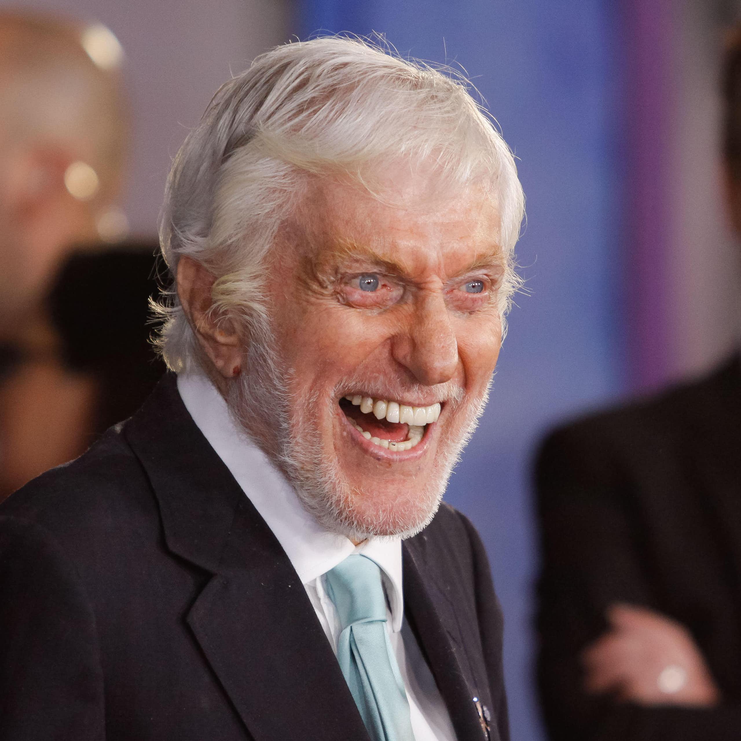 Dick Van Dyke smiles for the camera at an event.