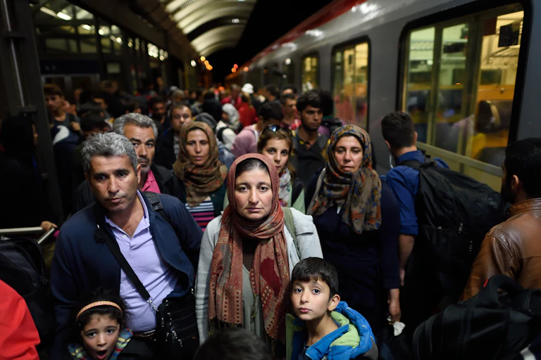 A group of people on a train platform