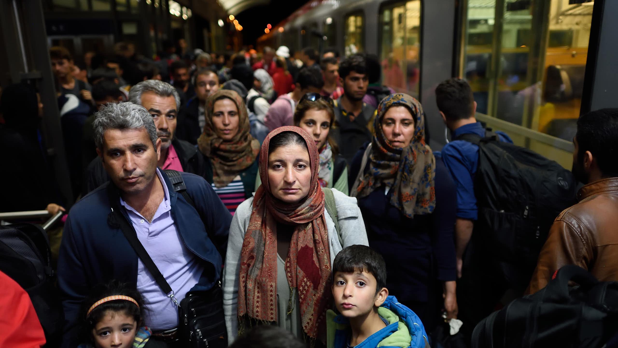 A group of people on a train platform