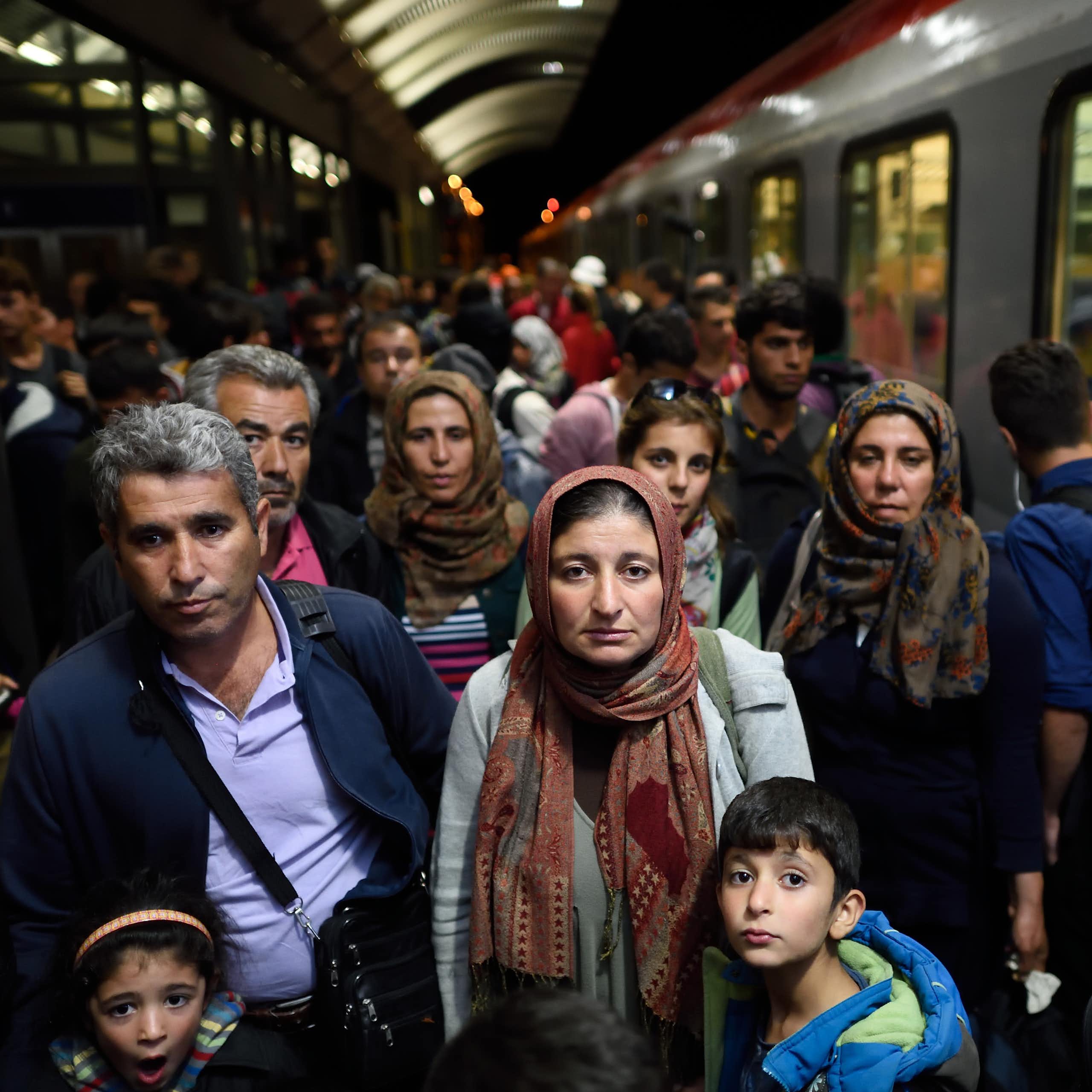 A group of people on a train platform