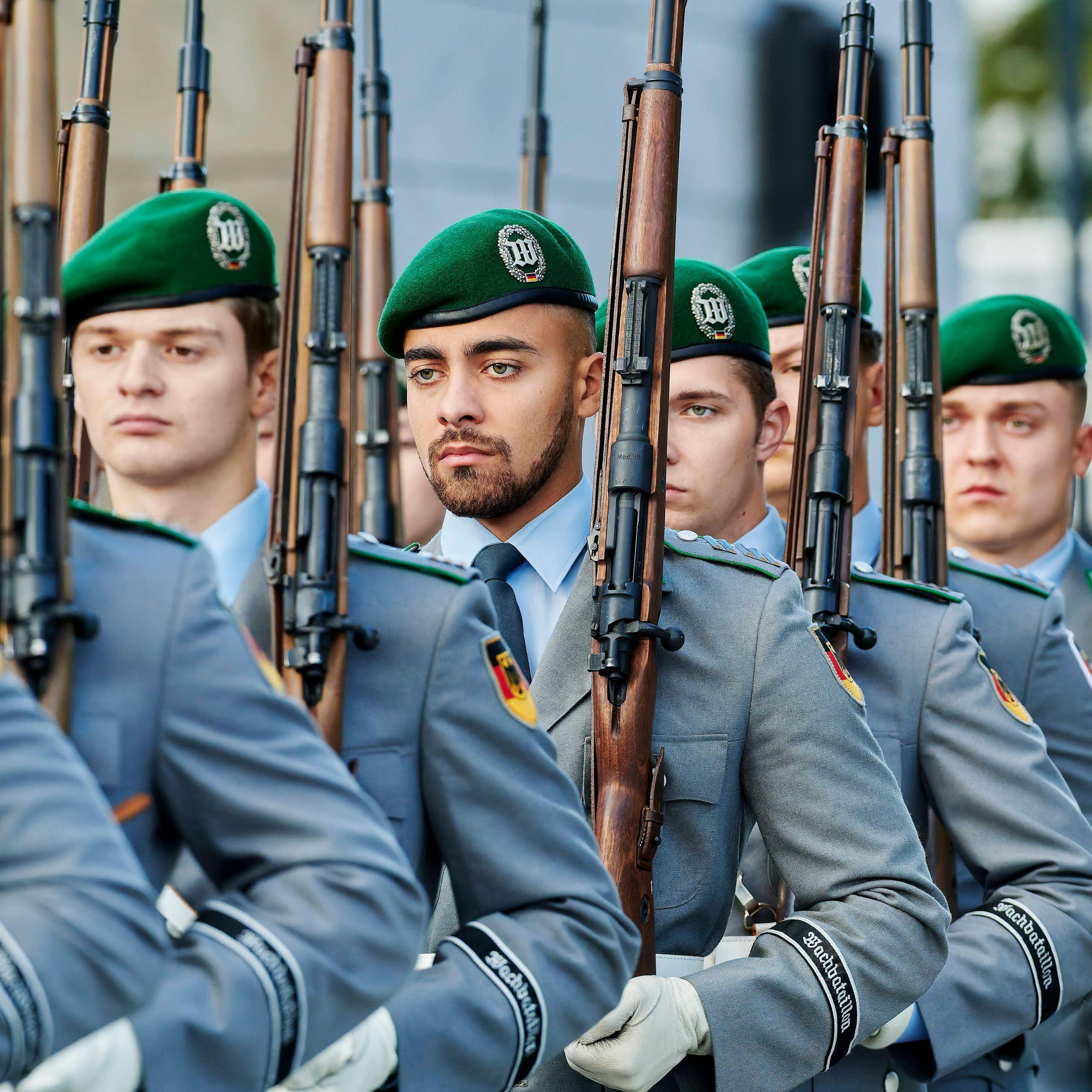 A rank of German soldiers marching.