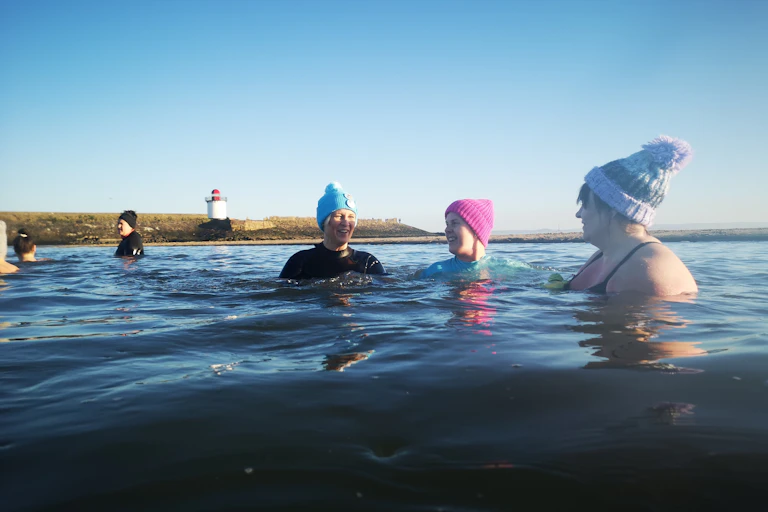 Women wild swimming.