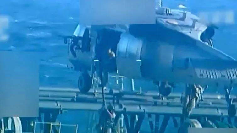 Screenshot of footage released by the US attorney-general's department shows US troops rappeling on to the deck of an oil tanker, December 10 2025.