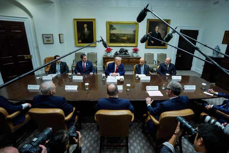 Donald Trump talks to journalists at a meeting in the Roosevelt Room at the WHite House, December 10.