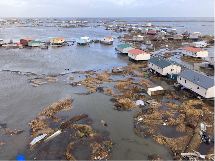 A town with homes surrounded by water.