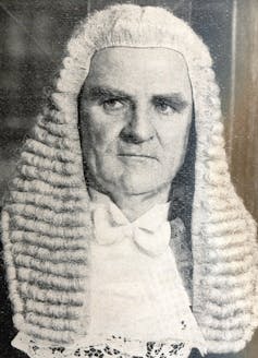 A black and white portrait of an older man in a juridicial wig