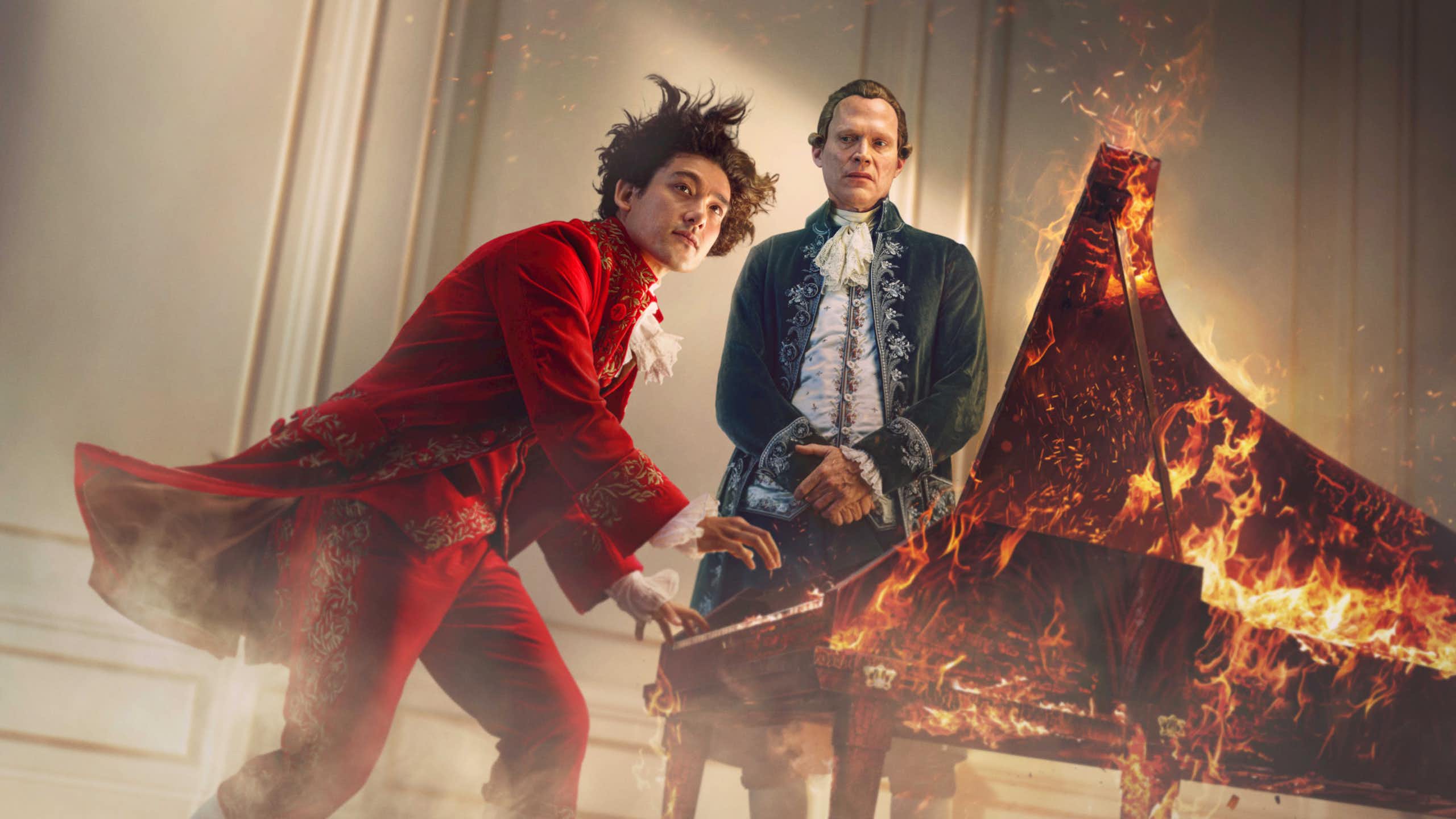 Will Sharpe as Mozart playing a piano which is on fire