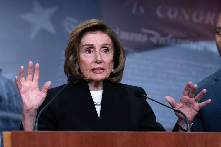 Nancy Pelosi, the former House speaker, gestures at a news conference.