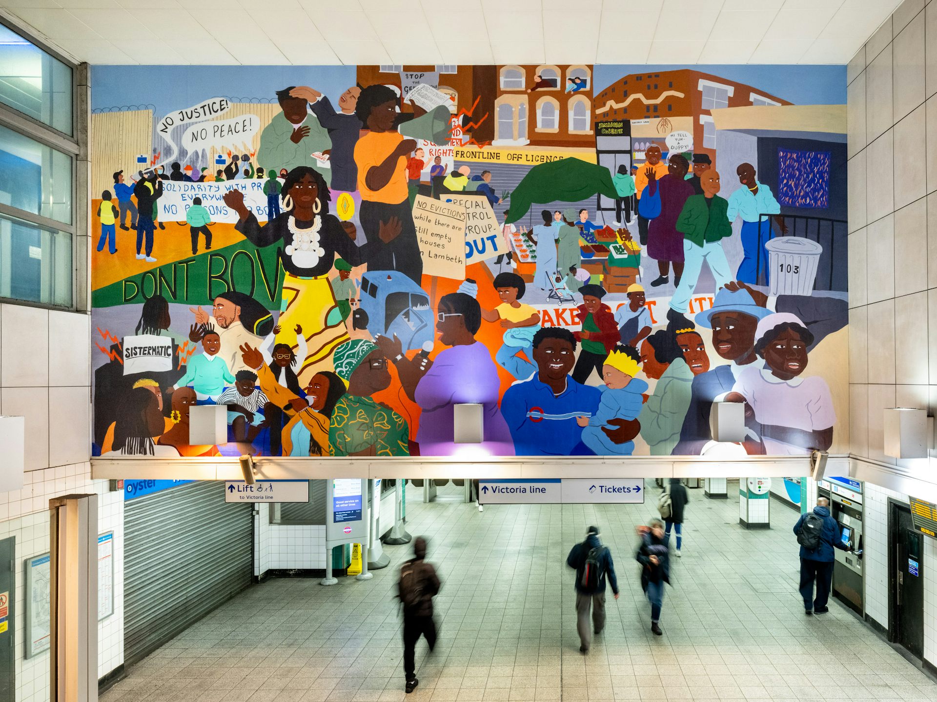A mural showing the Afro-Caribbean community avove the entrance to Brixton tube station.