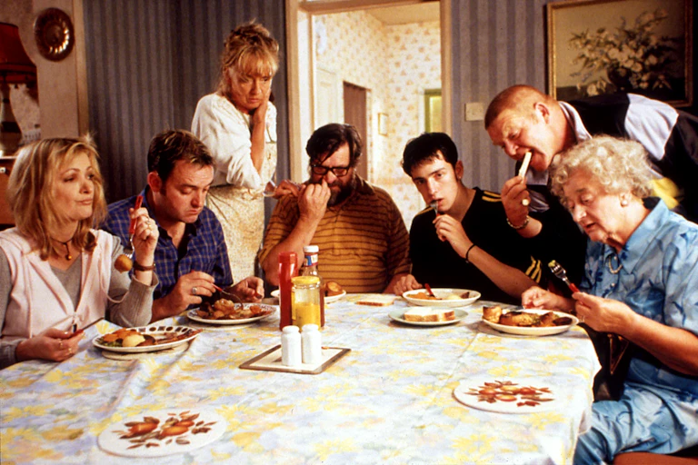 TV's Royle family eating a roast dinner together.