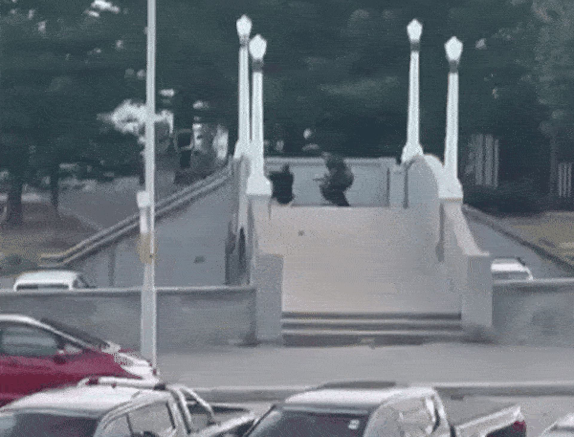 The gunman returns to the bridge and re-arms.